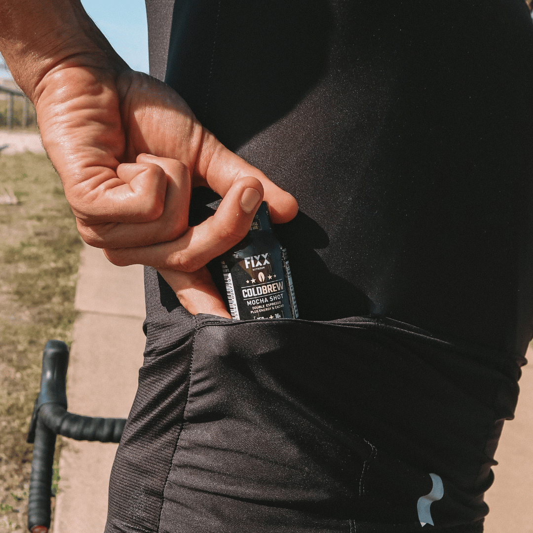 man drinking a cold brew coffee shot